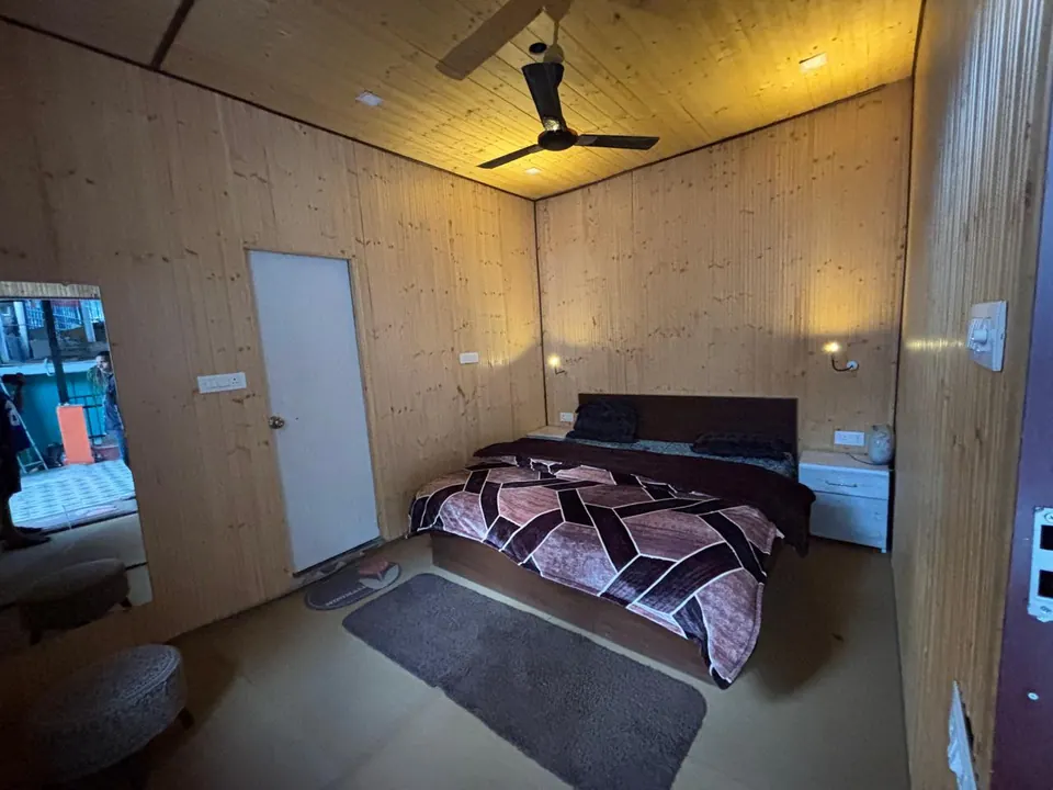 Cozy Room bed and wood-panelled interior
