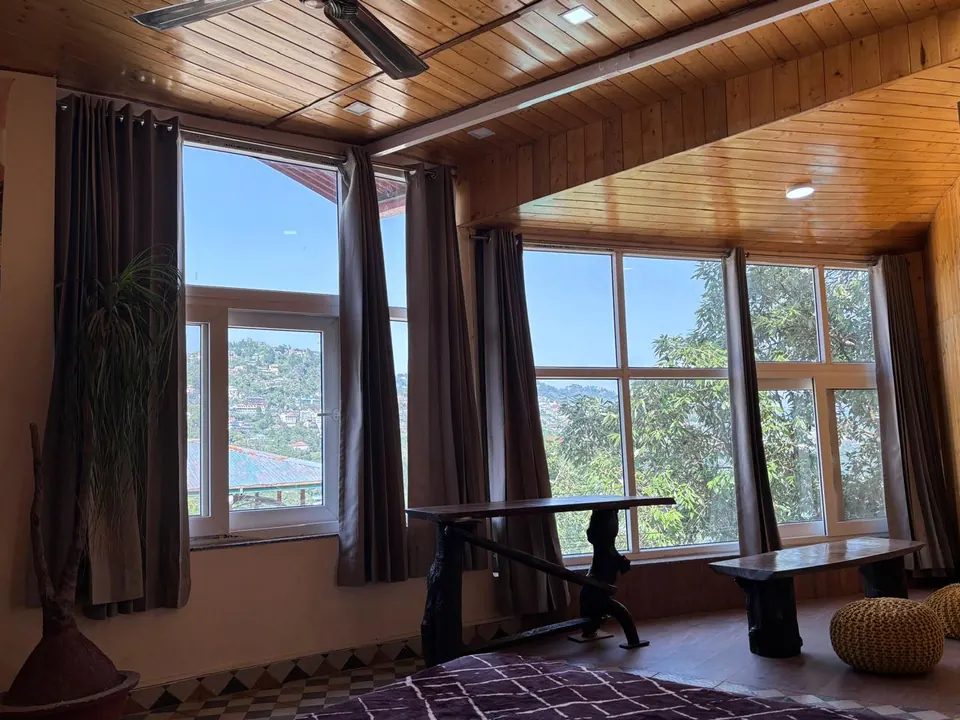 Grand View Room seating and large windows overlooking the hills